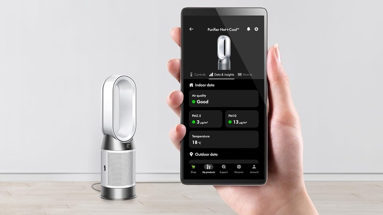 Dyson HP1 heater and air purifier sitting on floor with app shown