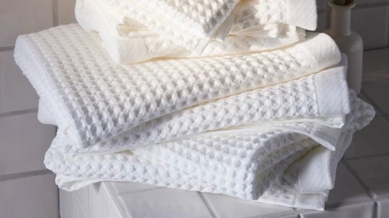 a pile of white waffle weave towels