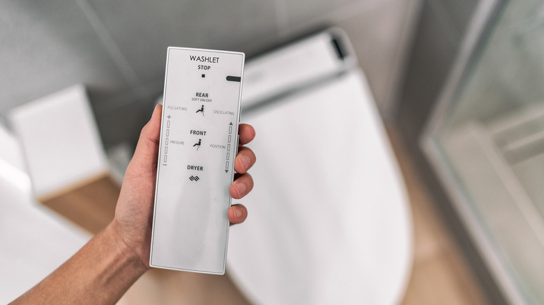 a smart japanese bidet automated toilet with remote