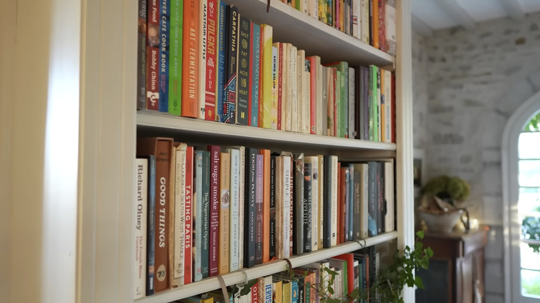 A large bookshelf filled with cookbooks