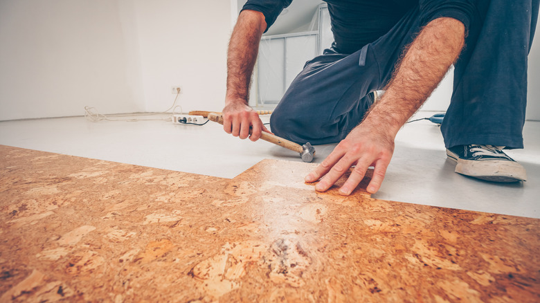 Man putting down a cork floor