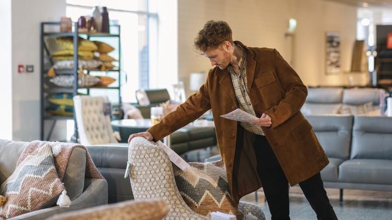 Someone shopping for a chair
