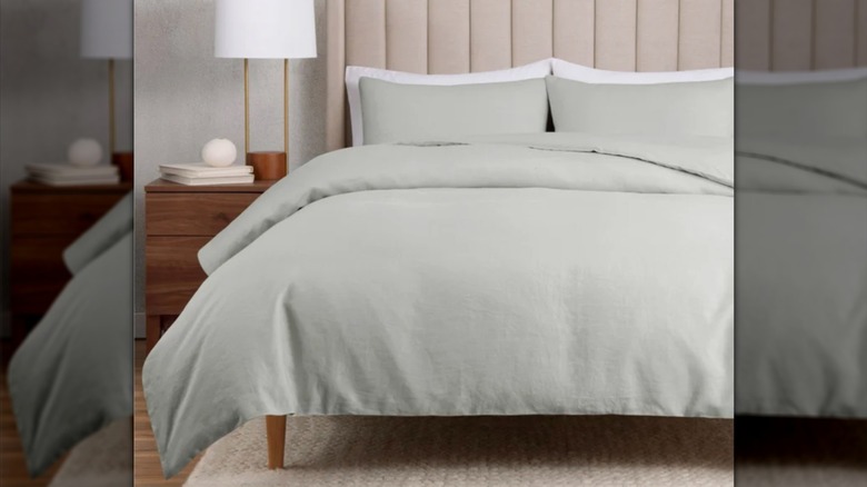 WelHome Duvet set in sage on a bed