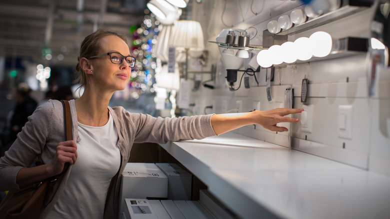 A person shopping for lighting