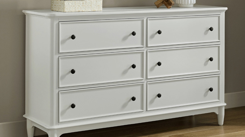 The Lila dresser up against a wall in a bedroom