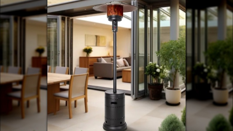 A Fire Sense matte black patio heater on a patio