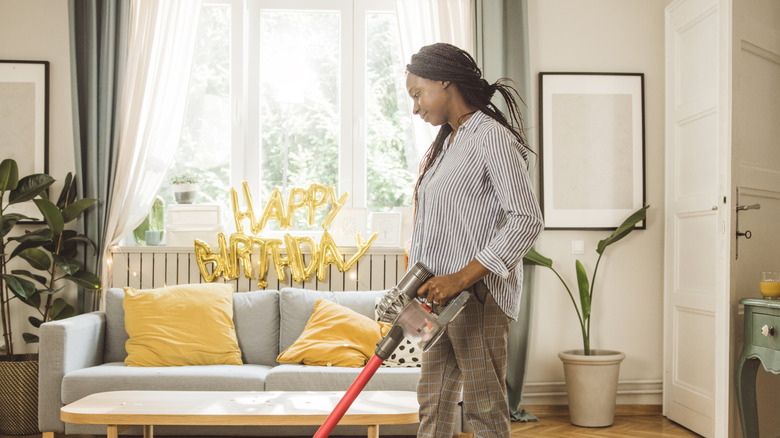 A young woman cleaning up wooden floors