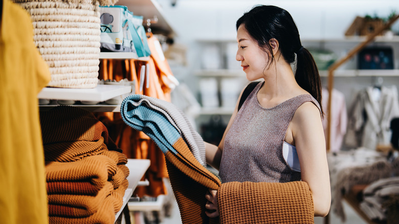 A woman shopping for towels and home items