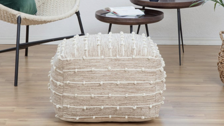 Woven pouf in living room space