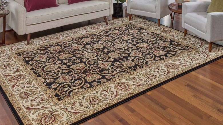 Thomasville Classic Rug in living area with wood floors, furniture, and plants