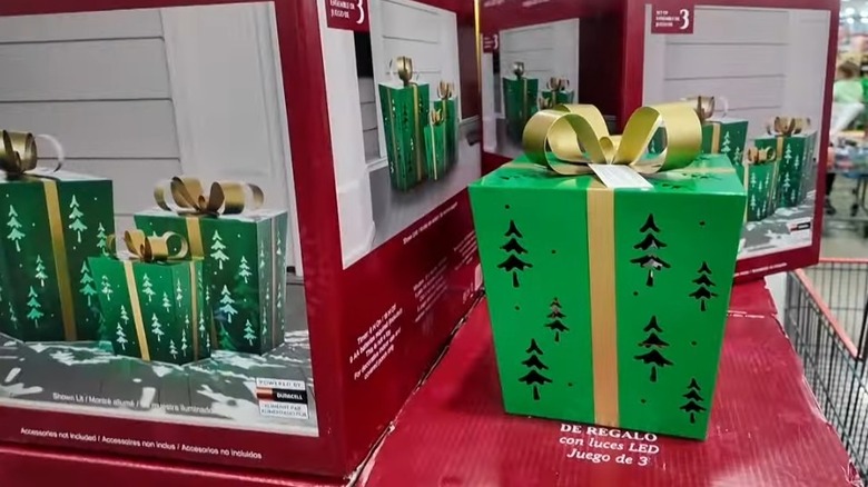 Set of three metal green light-up gift boxes