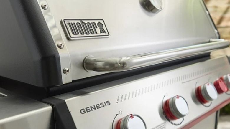 Weber Genesis grill sitting on a deck