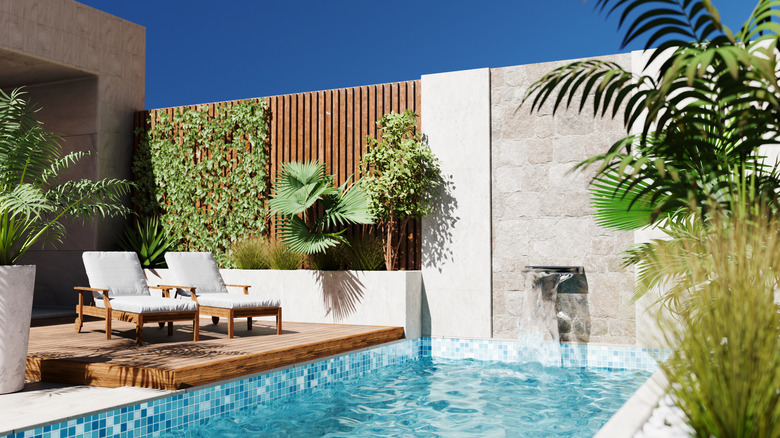 A beachy patio with wooden accents surrounding a swimming pool