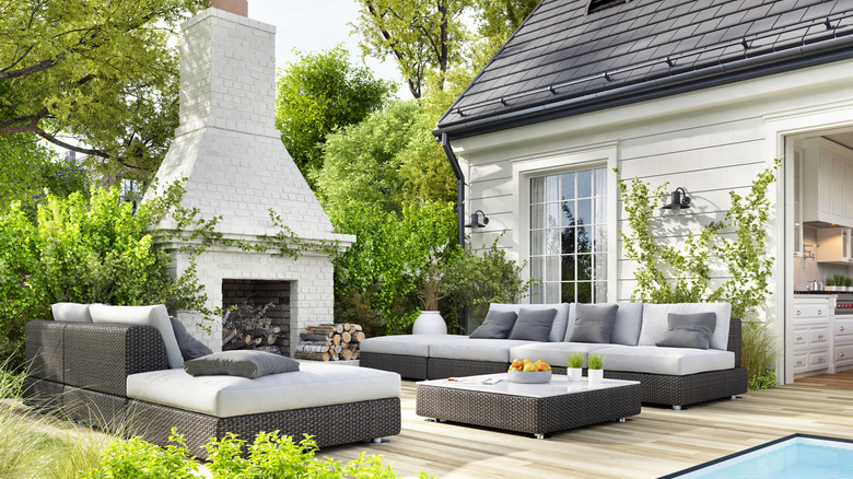 An outdoor patio with different furniture pieces