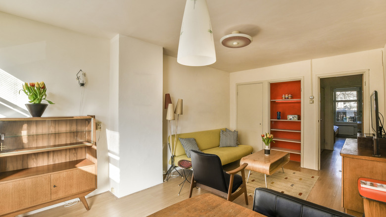 mid century modern home with various storage tables and decor pieces