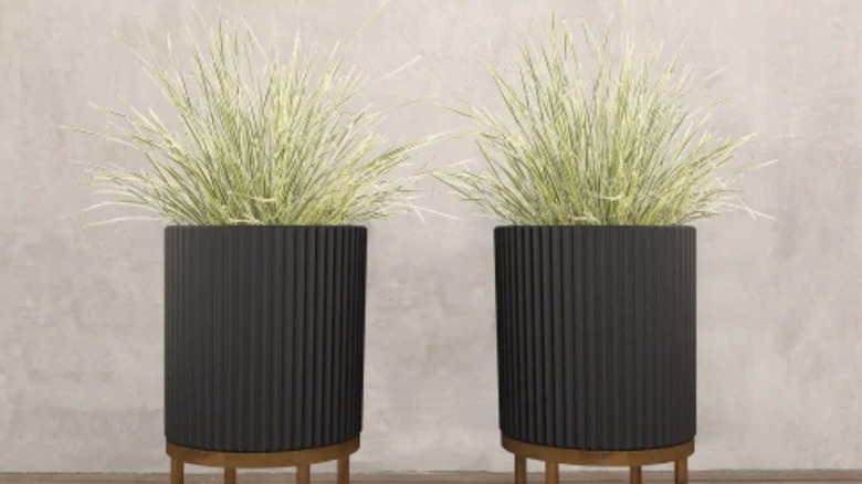 Two Capri planters with wood stands that are similar to the popular 16-inch Veradek planters