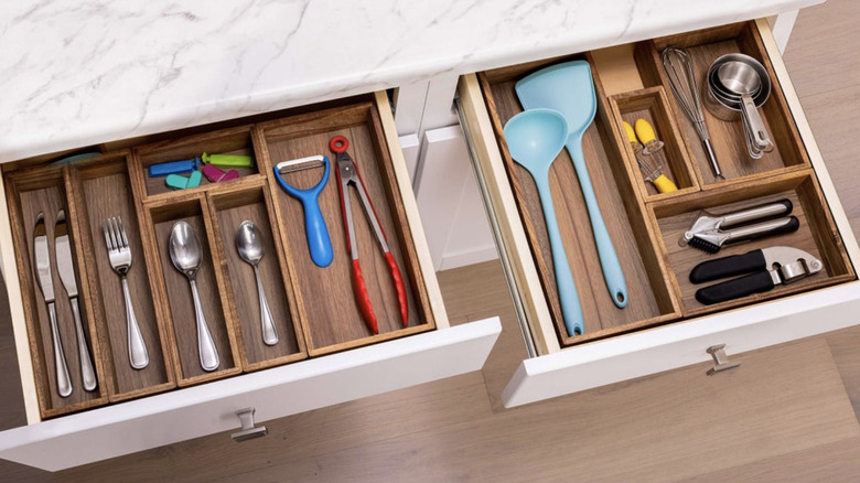 Costco drawer organizers used in kitchen drawers for silverware and other utensils.