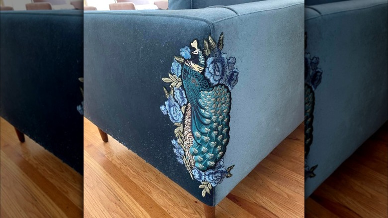 Blue couch with corner patch