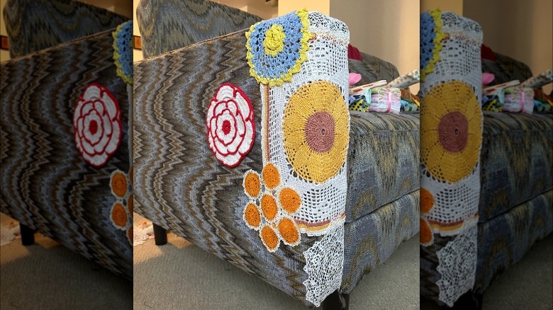 Vintage couch with doily patches