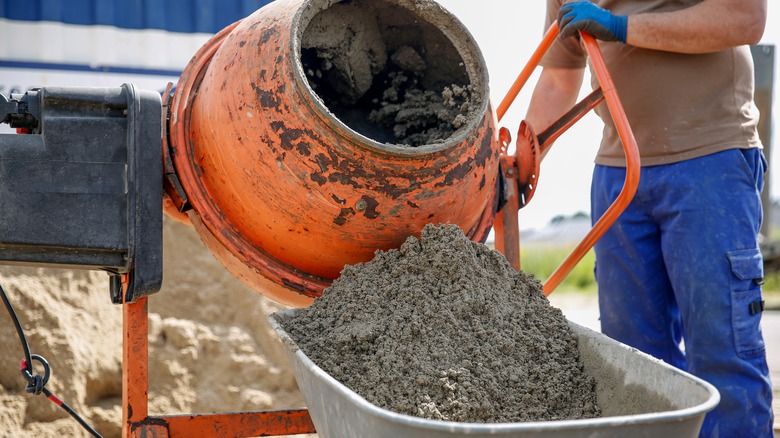 A man mixing a small batch of concrete