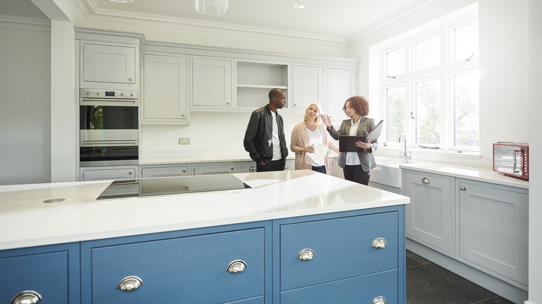 Homebuyers viewing a kitchen