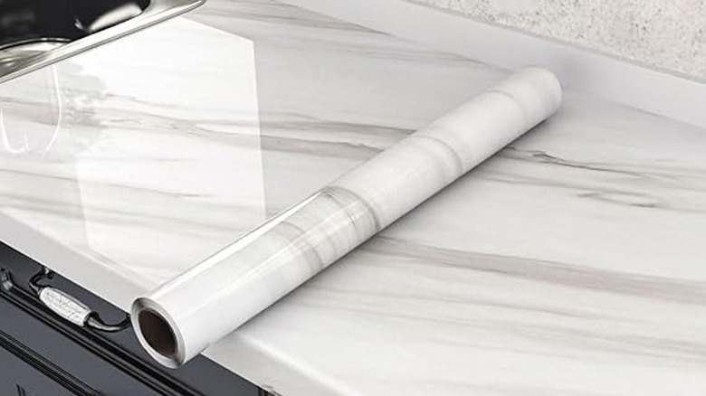 Person measuring countertop