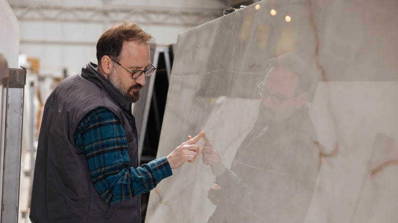 Man looking a marble surface