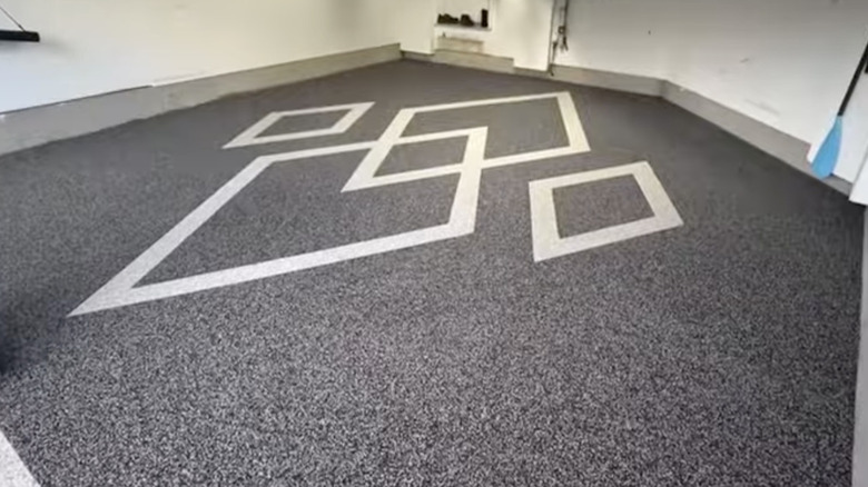 A residential garage with rubber flooring installed