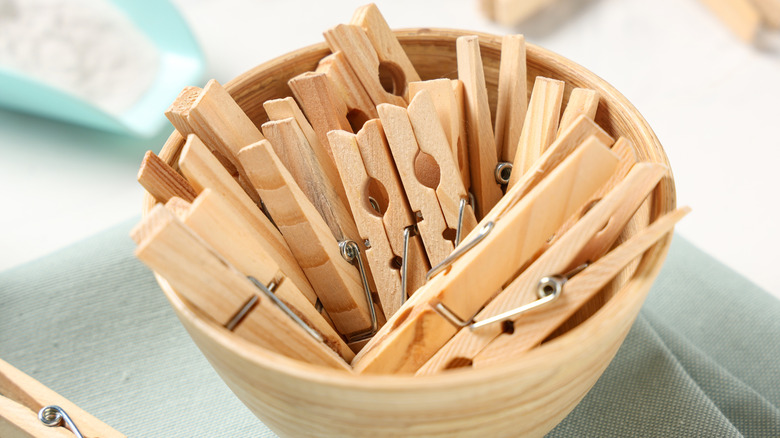 Clothespins in a glass bowl.