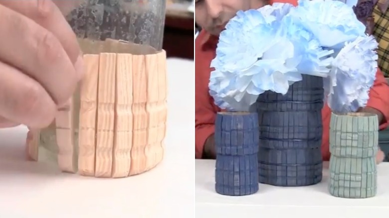 Glass jar with clothespins glued to the outside.