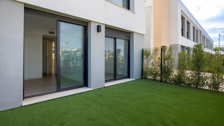 Sliding glass doors opening up to backyard