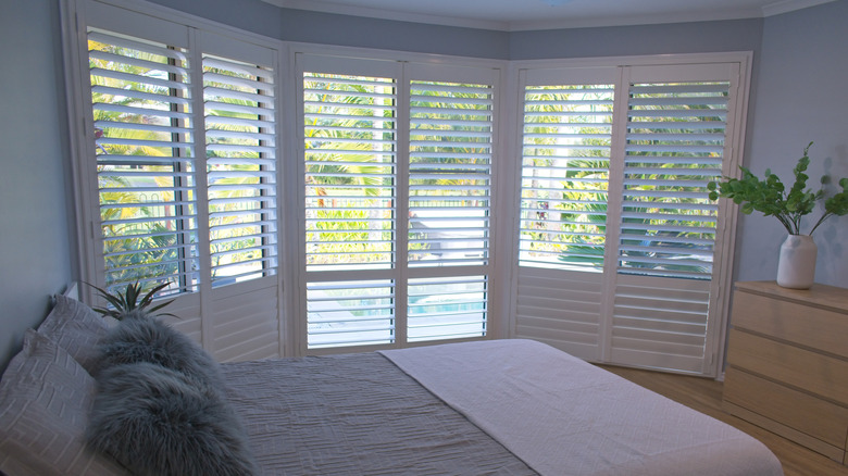 Bifold shutters in bright contemporary bedroom