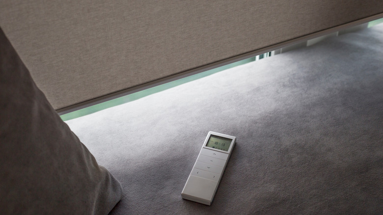 Remote next to motorized roller shades