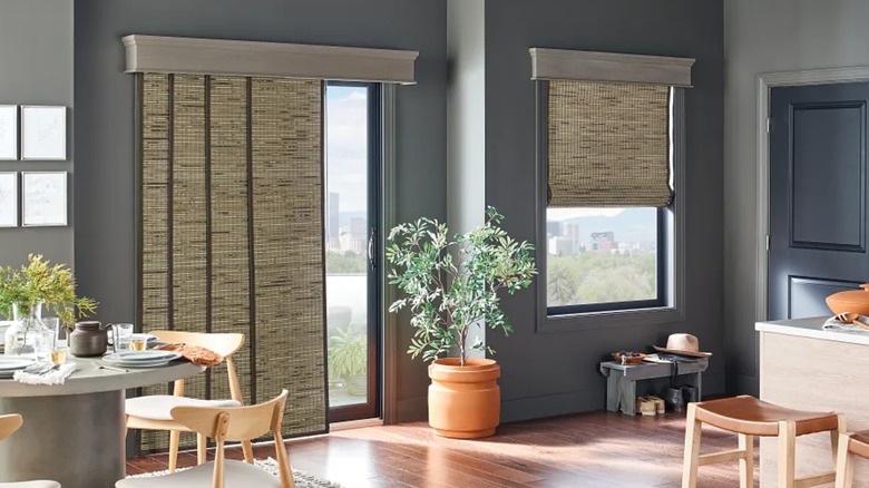 Bali Blinds Sliding panel blinds installed on sliding door in contemporary kitchen