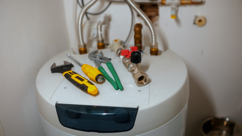 Hot water heater with tools on it