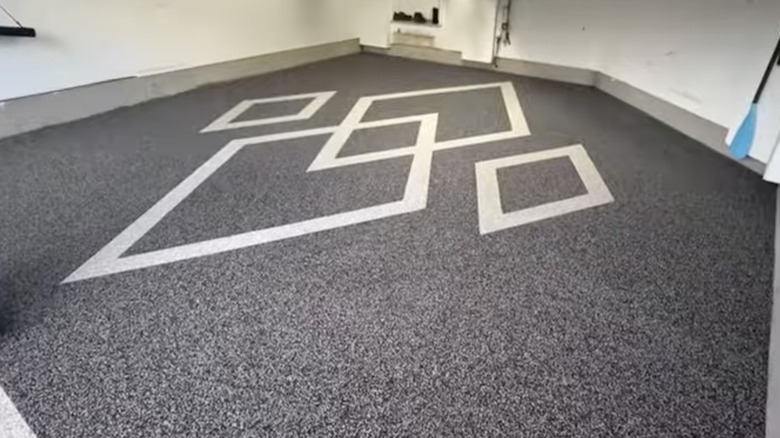 A residential garage with rubber flooring installed