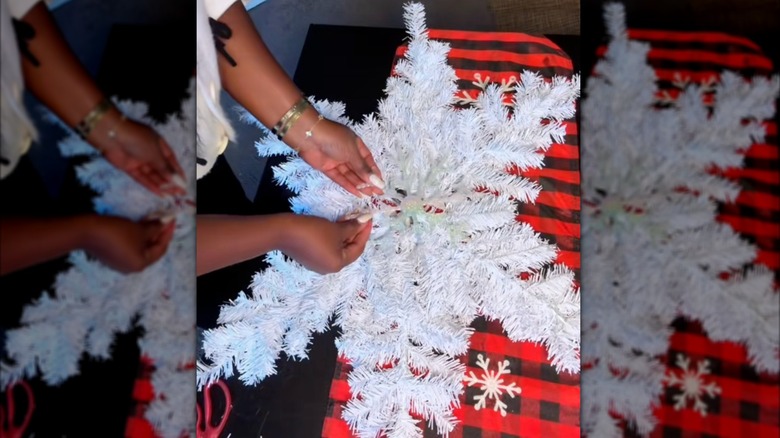 A DIY snowflake is made with mini Christmas trees