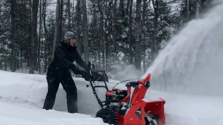 Woman blowing deep snow with a Craftsman snow blower