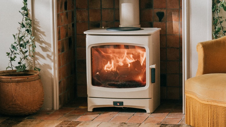 closeup of a fireplace with a tiled background