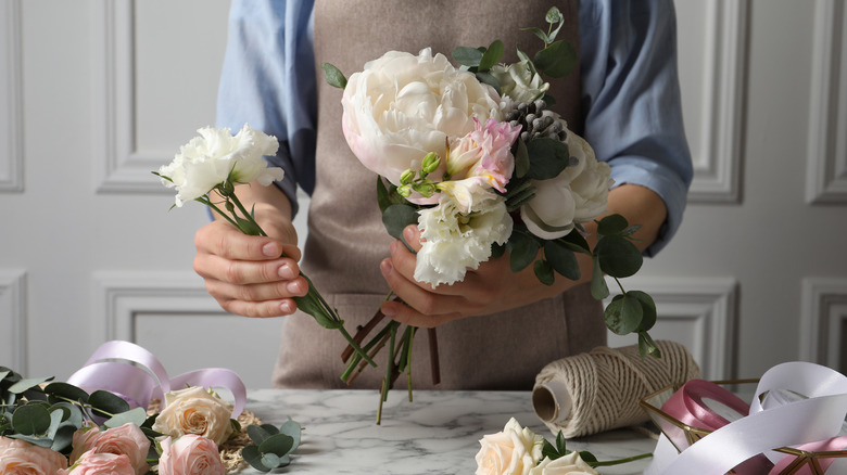 person working with flowers