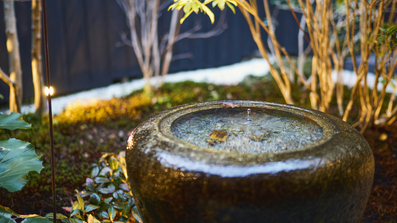 A close up of a Japanese-inspired outdoor water fountain