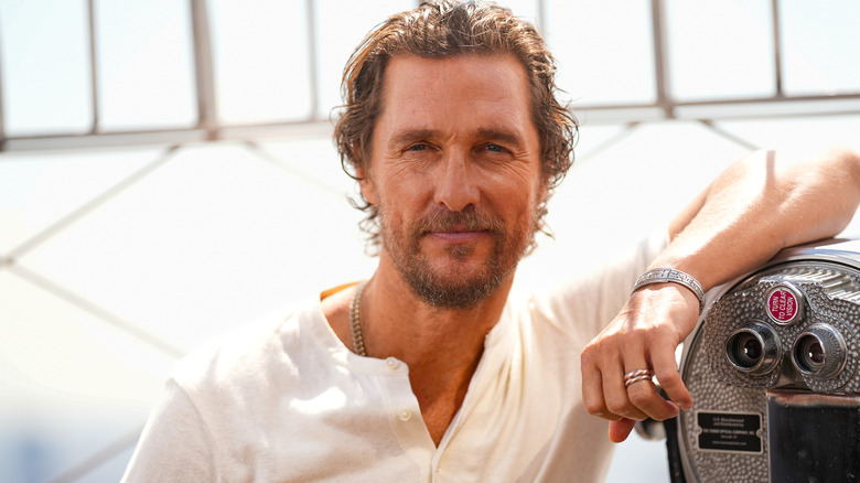 Closeup of Matthew McConaughey wearing a white shirt outdoors