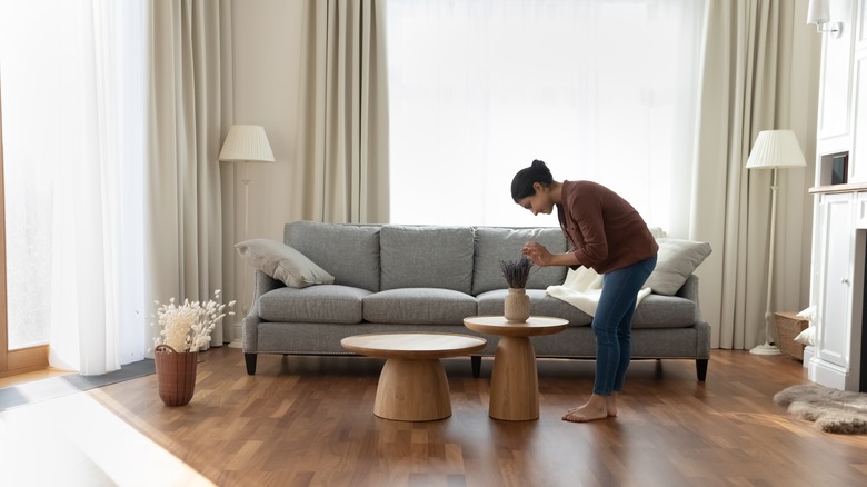 Woman decorates side table