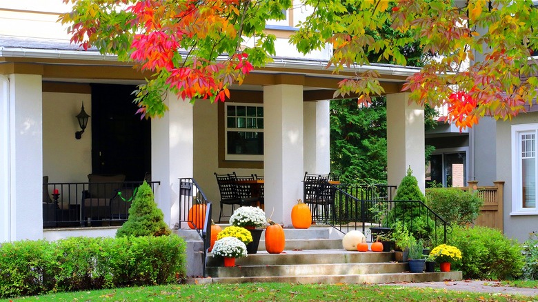 Front porch decorated for fall