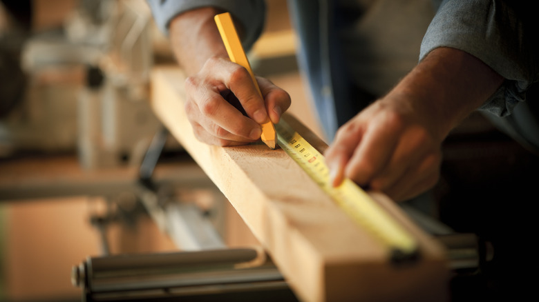 measuring wood for DIY project