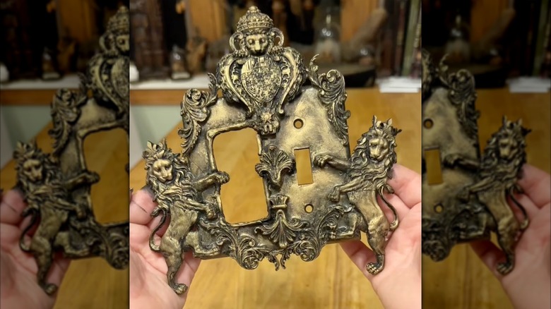 person holding DIY outlet cover