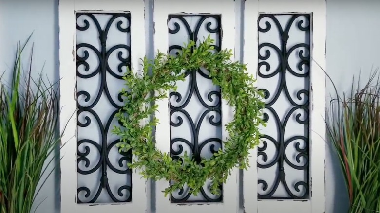 Three finished rustic wall decor pieces made from Dollar Tree items