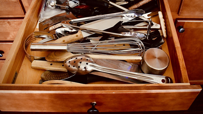 Messy kitchen silverware drawer