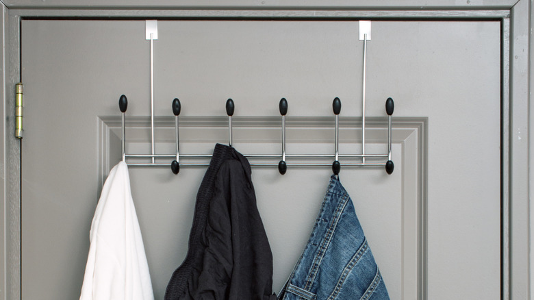 Clothes hanging on door rack