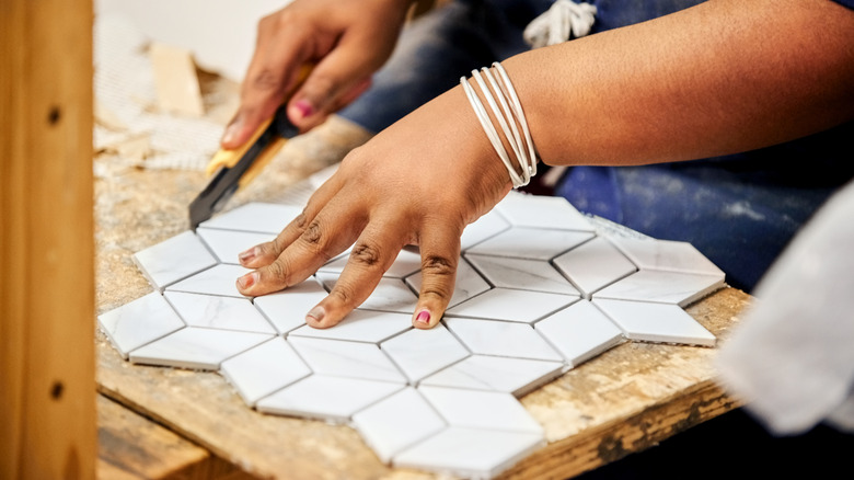 Cutting a piece of mosaic tile